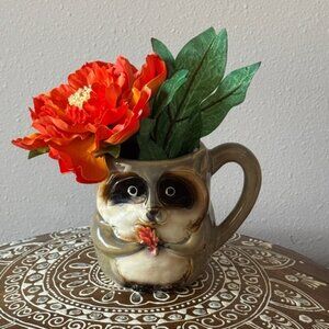 Charming Raccoon Mug with Orange Flower Accent